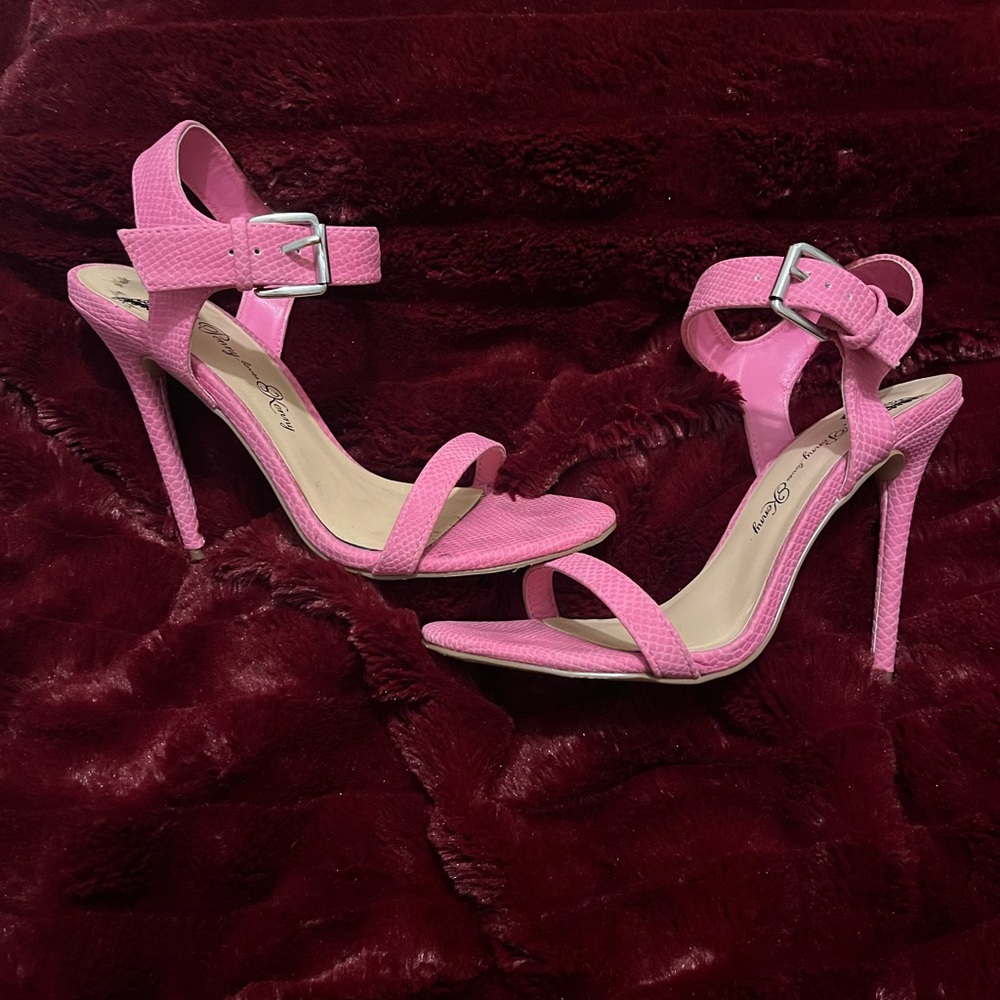 Pink snakeskin heels.